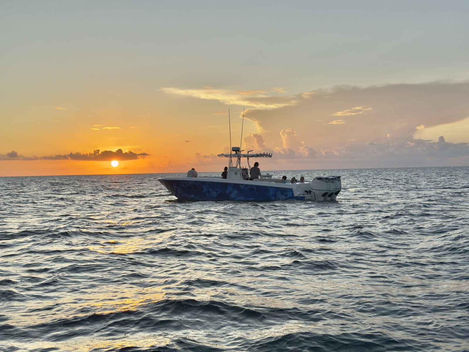 Private Key West sunset cruise with warm evening light over calm water